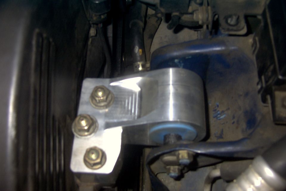 Aftermarket aluminum motor mount with blue bushing