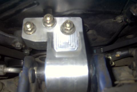 1994 Dodge Stealth - Close-up view of an aftermarket aluminum engine motor mount assembly.
