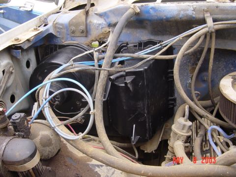 1989 Ford Bronco - The heater box and associated ducting are visible in this engine bay shot.