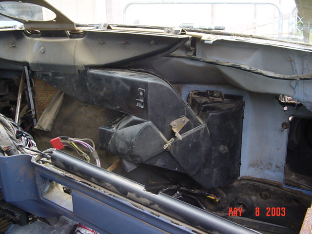 Exposed under-dash HVAC heater box and ductwork with wiring, dated May 8 2003