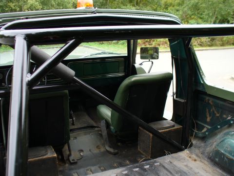 1978 Ford Bronco - Interior of a 1978 Ford Bronco showing the roll cage and seating.