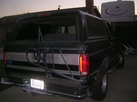 1985 Ford Bronco - Rear view of a Ford Bronco, showing its spare tire carrier and license plate.