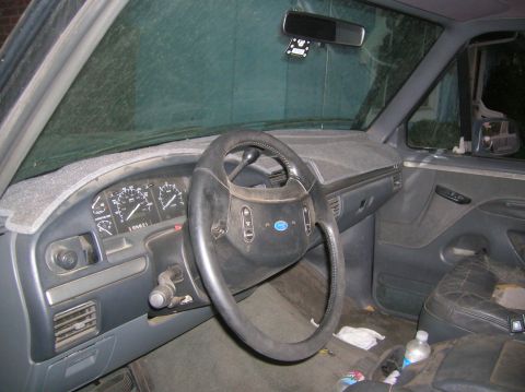 1985 Ford Bronco - Interior of a 1992 Ford F-150 pickup truck, showing the dashboard and steering wheel.