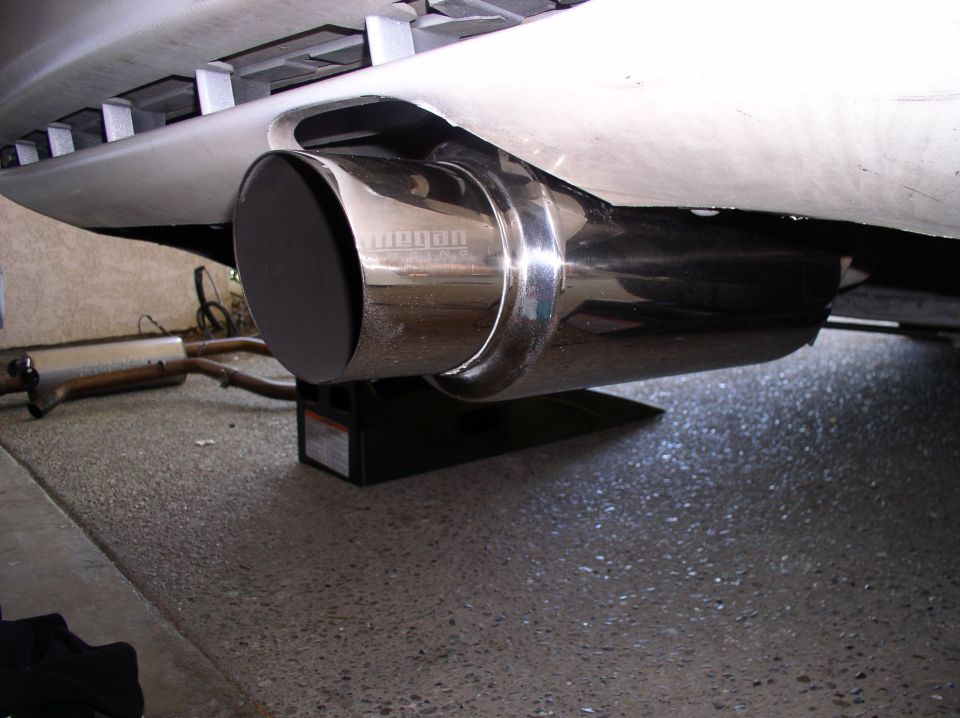 Chrome exhaust tip with 'Megan' logo