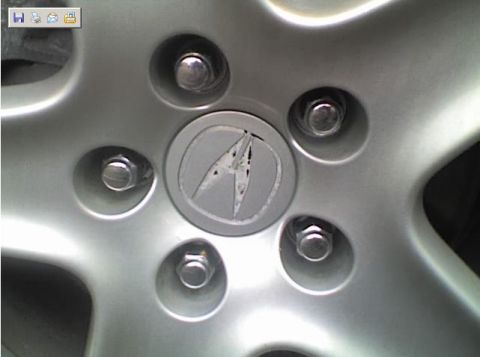 1990 Ford Bronco - The center cap on this vehicle's wheel features the Acura logo.