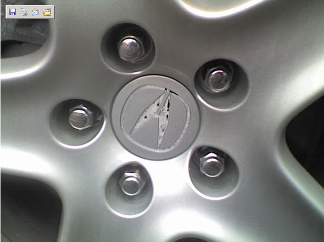Close-up of an Acura wheel with the center cap visible