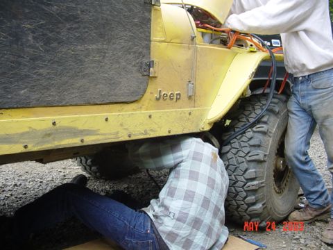 1989 Ford Bronco - Jim doing some makeshift welding to Hips jeep before we take off for the morning run