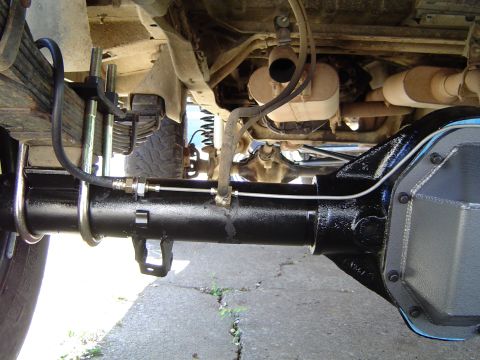 1978 Ford Bronco - Underside view of a vehicle's rear axle and suspension system.
