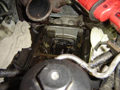1992 Ford Bronco - Close-up view of an engine compartment during maintenance, showing internal parts and tools.