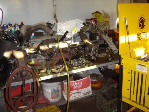 1992 Ford Bronco - Engine parts and tools are organized on a workbench next to a Matco Tools cabinet.
