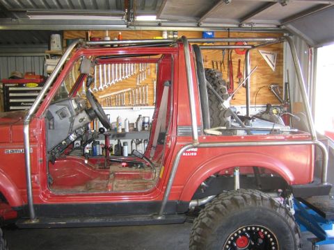 1987 Suzuki Samurai - This 1987 Suzuki Samurai has been modified with an extensive external roll cage and off-road tires.