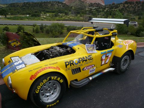 1975 Ford Ranchero - This yellow race car features numerous sponsor decals, including 'Propane Exceptional Energy' and the number 17.