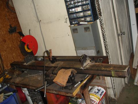 1989 Ford Bronco - Custom steel bumper fabrication in progress, with tools and workshop equipment visible.