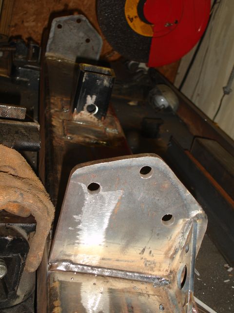 1989 Ford Bronco - Custom metal fabrication parts are being worked on in a garage setting.