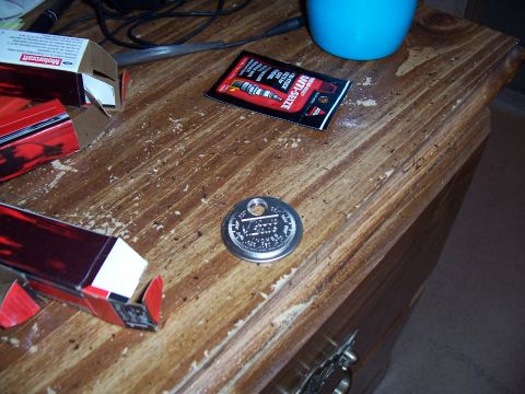 2003 Ford Ranger - A packet of spark plug anti-seize and two Motorcraft boxes are on a wooden table.