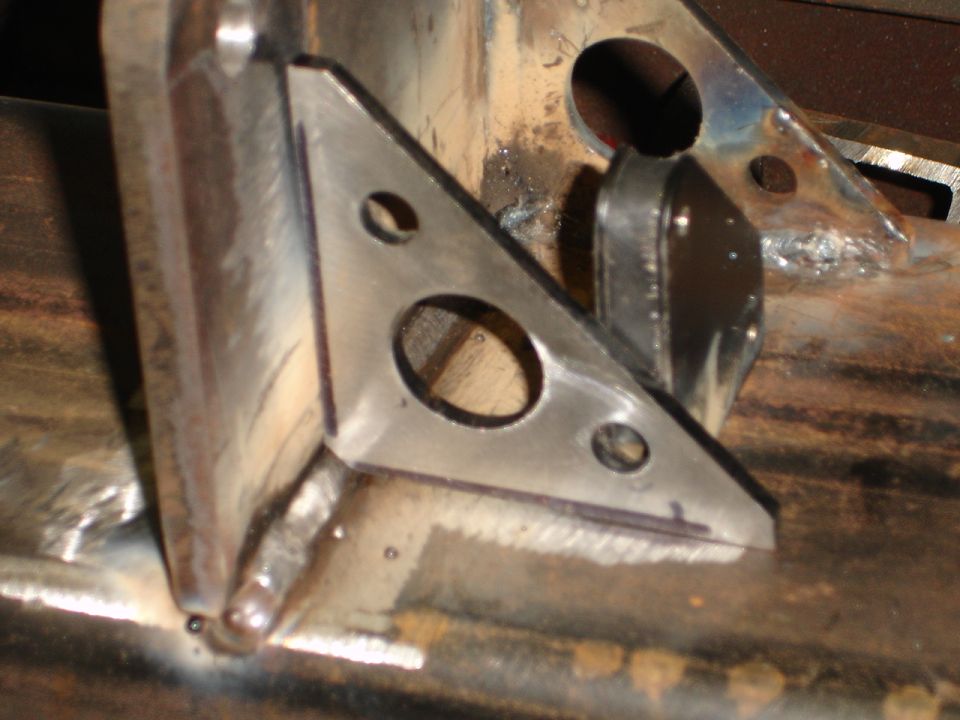 Metal bracket with holes, part of a rear bumper build