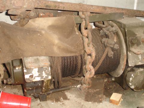 1989 Ford Bronco - Close-up of a rusty winch mechanism, likely for a vehicle or industrial equipment.