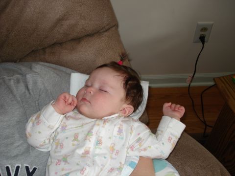 2000 Ford Crown Victoria - A baby is asleep on a couch, with a power outlet visible on the wall in the background.