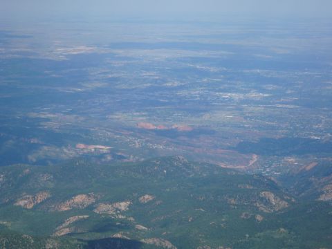1975 Ford Ranchero - Aerial view of a vast landscape, showing mountains and a settlement in the distance.