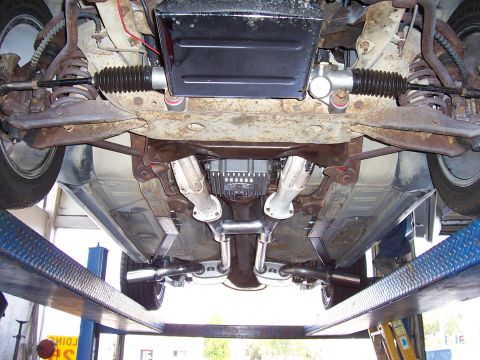 1978 Ford Mustang II - Undercarriage view reveals a dual exhaust system and steering rack, with no visible year-specific details.