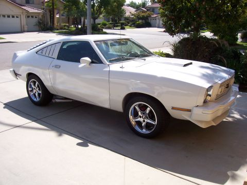 1978 Ford Mustang II - White 1978 Ford Mustang II coupe parked on a driveway, aftermarket wheels and rear window louvers.