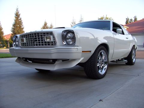 1978 Ford Mustang II - Front 3/4 view of a white 1978 Ford Mustang II, custom wheels and a front air dam.