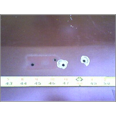 1973 Ford Ranchero - Tailgate section with holes, measured with a ruler.