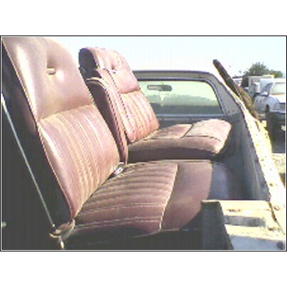 1973 Ford Ranchero - Interior view of a 1973 Ford Ranchero, highlighting the bench seat and additional seating in the bed.