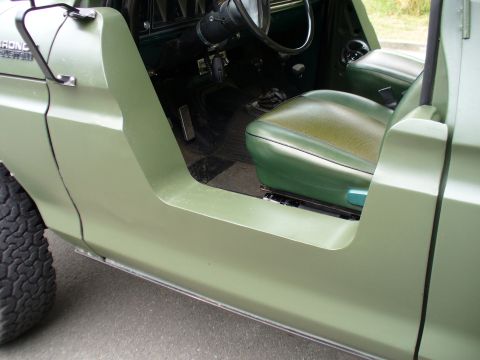 1978 Ford Bronco - Interior view of a 1978 Ford Bronco, highlighting the green upholstery and dashboard details.