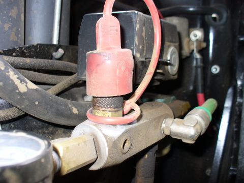 1978 Ford Bronco - Detail of an air compressor fitting, likely part of an on-board air system.