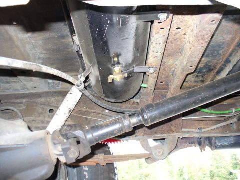 1978 Ford Bronco - This photo shows the undercarriage of a vehicle, focusing on an installed air tank and associated components.