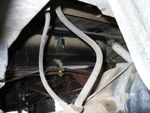 1978 Ford Bronco - Undercarriage view shows air lines and suspension components, with a black tank mounted underneath.