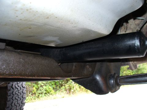 1978 Ford Bronco - Close-up of the undercarriage, showing the crossmember and suspension components.