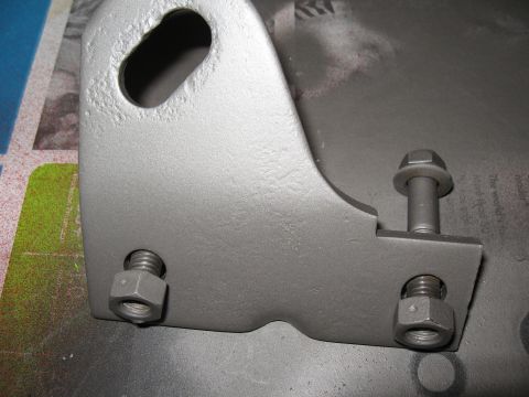 1968 Shelby GT500 - Close-up of a painted metal bracket with hardware. The album claims it is from a 1968 Shelby GT500.