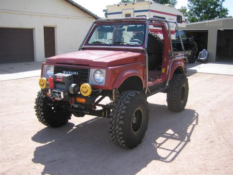 1987 Suzuki Samurai - This modified Suzuki Samurai features a winch and custom roll cage, ready for off-road adventures.
