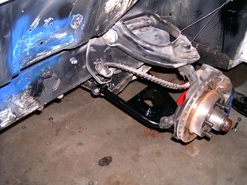 1978 Ford Mustang II - The photo shows the front suspension and brake system of a vehicle, likely during a repair or upgrade.