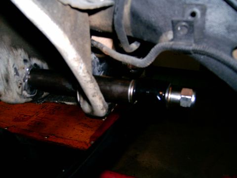 1978 Ford Mustang II - A close-up view of a vehicle's suspension system, focusing on a specific component.