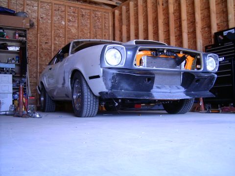 1978 Ford Mustang II - This vehicle appears to be undergoing restoration or modification in a garage setting.