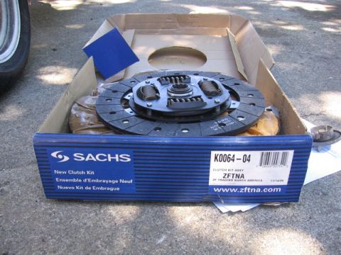1989 Ford Bronco - A new Sachs clutch kit is shown in its box, with a portion of a vehicle's tire visible in the background.
