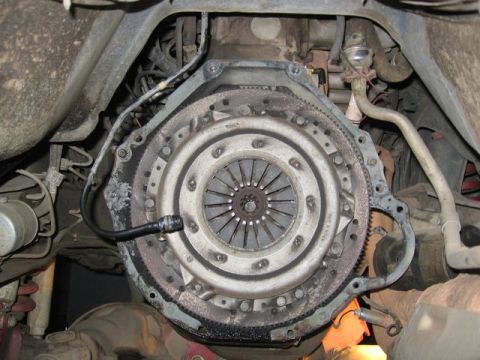 1989 Ford Bronco - The vehicle's clutch assembly is exposed, revealing the pressure plate and clutch disc components.