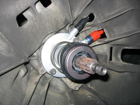 1989 Ford Bronco - Close-up view of a vehicle's clutch release bearing and input shaft.