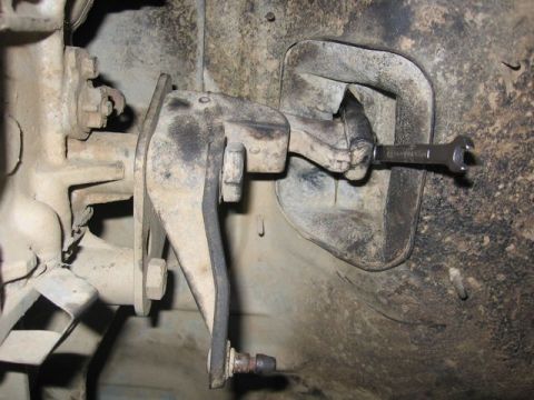 1989 Ford Bronco - Wrench on clutch linkage, likely part of a repair or upgrade.
