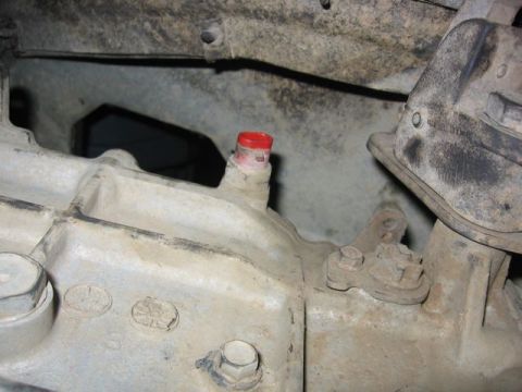 1989 Ford Bronco - Close-up view of a vehicle's transmission housing, showing mechanical components.