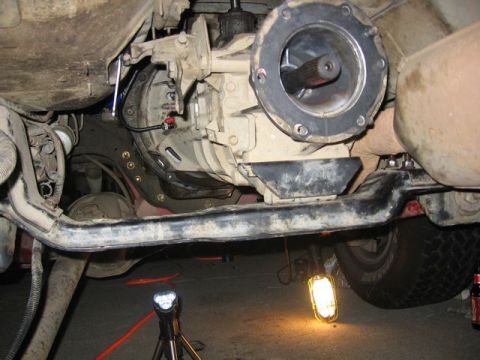 1989 Ford Bronco - The undercarriage of a 1989 Ford Bronco, focusing on the transmission and driveshaft assembly.