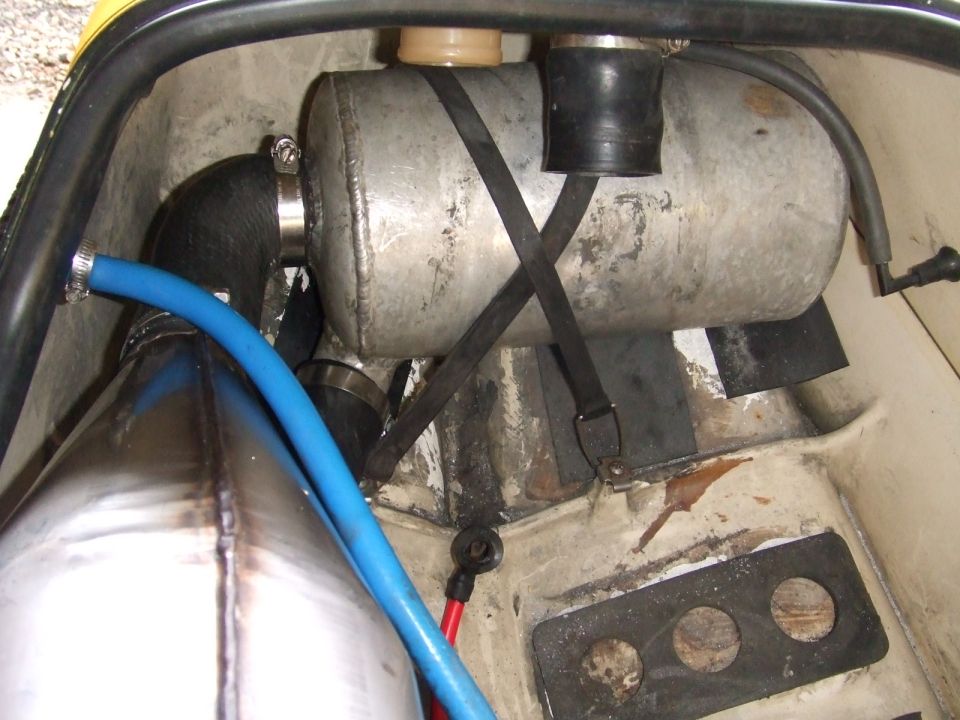Welded aluminum water box and stainless exhaust pipe inside a jet ski hull