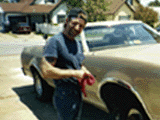 1978 Ford Ranchero - A man stands next to a gold pickup truck, holding a red rag.