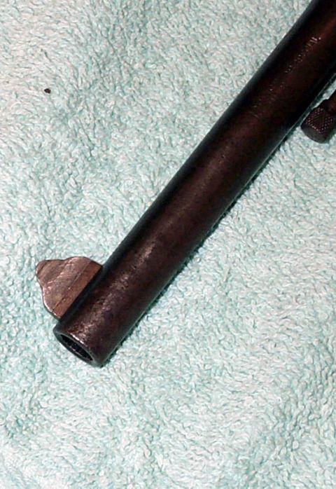 1996 Ford Bronco - Close-up of a firearm barrel on a textured cloth.