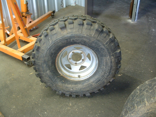 Tire and rim with aggressive tread pattern