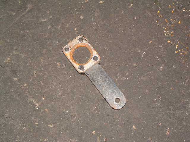 Metal bracket with circular opening and mounting holes