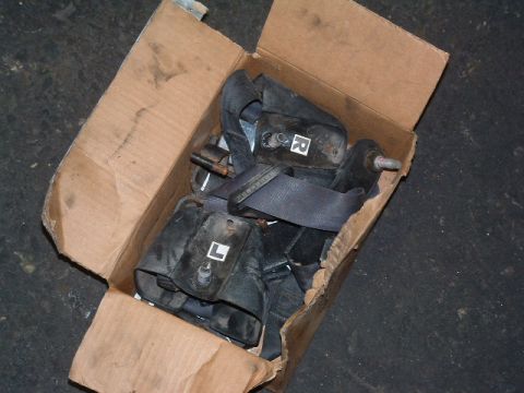1994 Jeep YJ - A cardboard box contains several seat belts, some marked with L and R indicators.